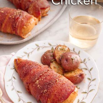 Pinterest graphic of a plate with a bacon wrapped chicken and baby potatoes with a glass of wine and more chicken in the back.