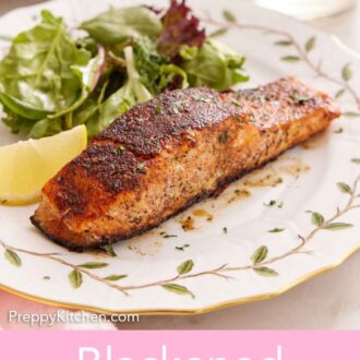 Pinterest graphic of a plate of blackened salmon with salad and a lemon wedge on the side.