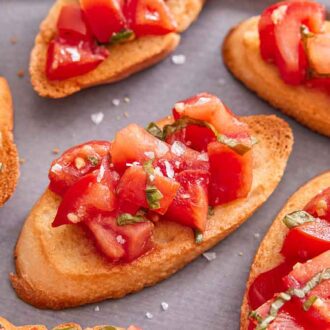 Close up view of bruschetta with salt sprinkled on top.