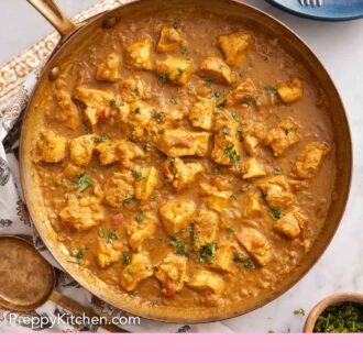 Pinterest graphic of an overhead view of a skillet of chicken curry.
