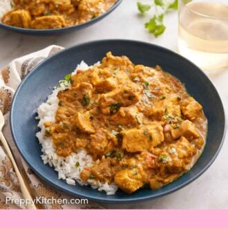 Pinterest graphic of a bowl of chicken curry over rice with a glass of wine and another plate in the back.