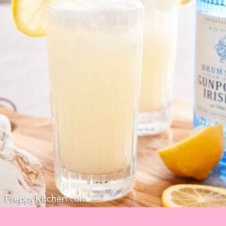 Pinterest graphic showing two Gin Fizz with cut lemons and a glass of gin in the background.