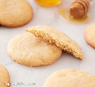 Pinterest graphic of honey cookies with one half cookie stacked on top.