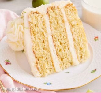 Pinterest graphic of a plate with a slice of key lime cake on it, showing the three cake layers and frosting in between.