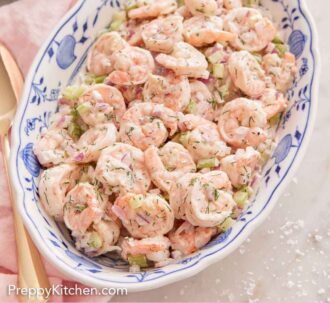 Pinterest graphic of an overhead view of an oval platter of shrimp salad.
