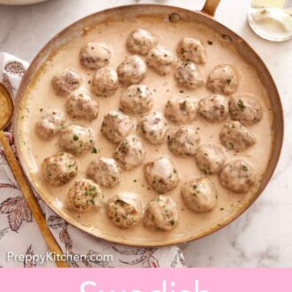 Pinterest graphic of a skillet of Swedish meatballs surrounded by forks, plates, garnish, and a linen.