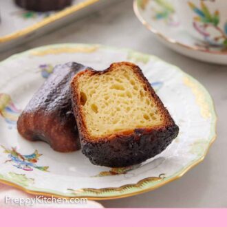 Pinterest graphic of a plate with a canelé cut in half with one half leaning on the other, showing the inside.