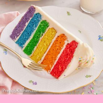 Pinterest graphic of a plate with a slice of raimbow cake with a fork and glass of milk in the background.
