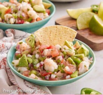 Pinterest graphic of a bowl of shrimp ceviche with a tortilla chip tucked into the bowl.