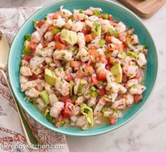 Pinterest graphic of an overhead view of a large bowl of shrimp ceviche with some chips and jalepeno in the background.