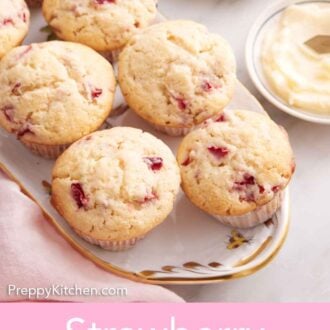Pinterest graphic of an overhead view of a platter of multiple strawberry muffins with a small bowl of butter side them.