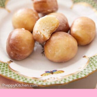 Pinterest graphic of a plate with multiple air fryer donut holes with one with a bite taken out.
