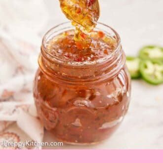 Pinterest graphic of a spoon lifting out of a jar of jalapeno jelly.