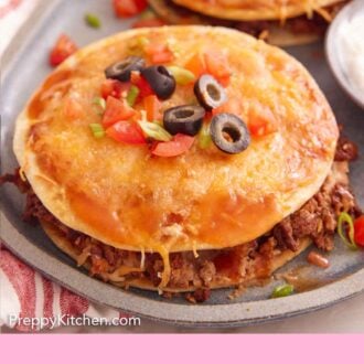 Pinterest graphic of a Mexican pizza with diced tomatoes, olives, and green onions on top.