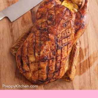 Pinterest graphic of a roasted duck on a cutting board with a knife.