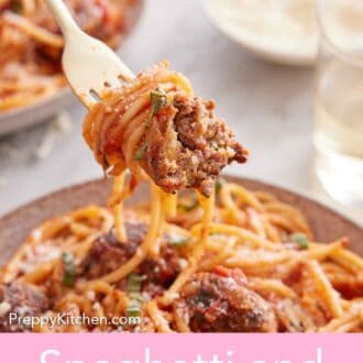 Pinterest graphic of a forkful of spaghetti and meatballs lifted from a plate.