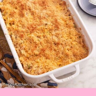 Pinterest graphic of a white baking dish with a freshly baked tuna casserole.