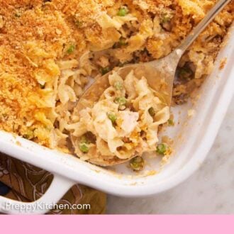 Pinterest graphic of an overhead view of a spoonful of tuna casserole in a baking dish.