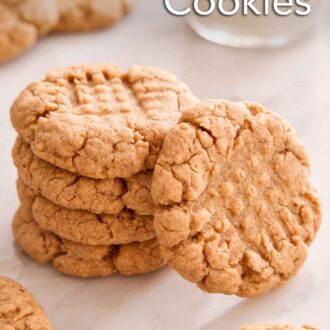 Pinterest graphic of a stack of almond butter cookies with one cookie leaning on the stack.