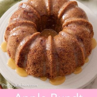 Pinterest graphic of an apple bundt cake on a cake stand with a glaze drizzled over it. Apples, plates, and forks in the background.