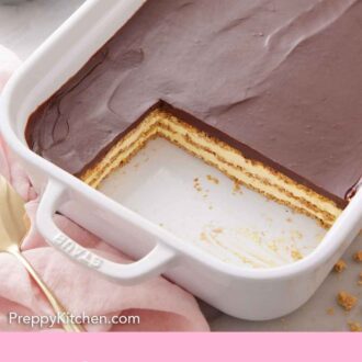 Pinterest graphic of an éclair cake in a baking dish with two slices cut out.