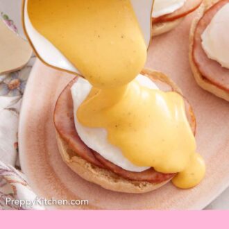 Pinterest graphic of hollandaise sauce poured over eggs benedict on a platter.