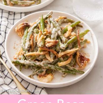 Pinterest graphic of two plates of green bean casserole with a glass of ice water.
