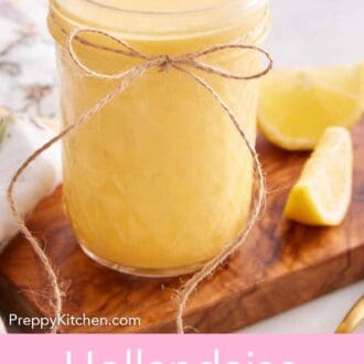 Pinterest graphic of a mason jar of hollandaise sauce with a bow tied on it with some lemon wedges beside it.