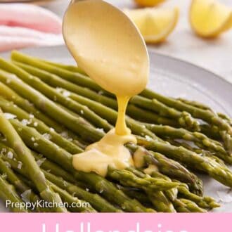 Pinterest graphic of hollandaise sauce spooned over asparagus.