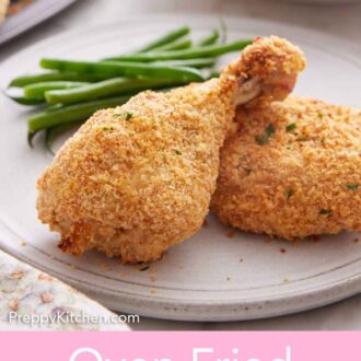 Pinterest graphic of a oven fried chicken drumstick on a plate with some green beans.