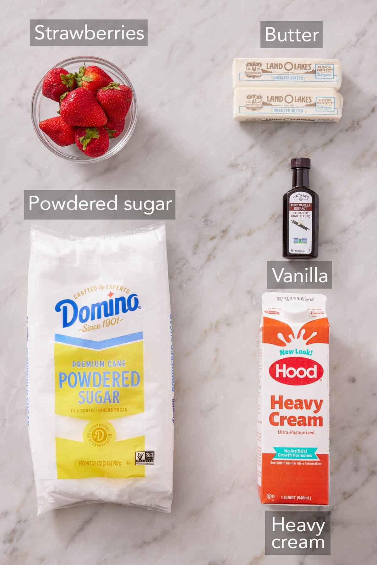 Ingredients needed to make strawberry frosting.