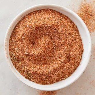 Overhead view of a plate of taco seasoning.