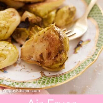 Pinterest graphic of a close up view of an air fryer Brussels sprouts on a plate with a fork.