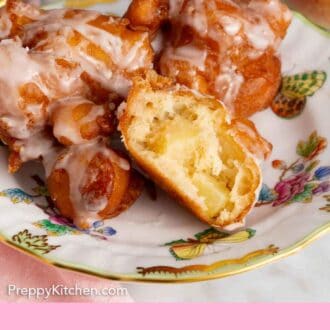 Pinterest graphic of a plate of apple fritters with one cut open, showing the interior.