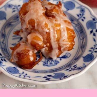 Pinterest graphic of a plate with apple fritters topped with a drizzle of glaze.