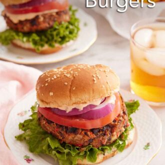 Pinterest graphic of a plate with a black bean burger with a drink in the back along with a second burger and bowl of fries.