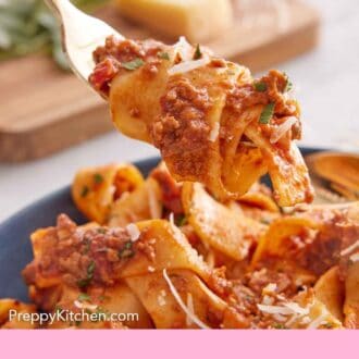 Pinterest graphic of a forkful of bolognese lifted from a bowl.