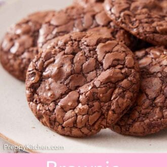 Pinterest graphic of a pile of brownie cookies on a plate.