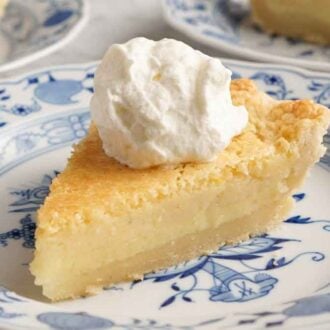 A plate with a slice of buttermilk pie with a dollop of whipped cream on top.