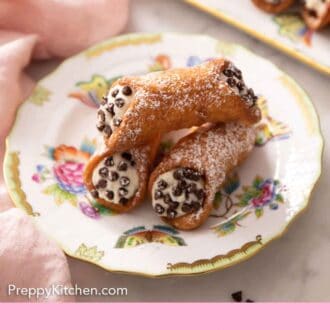 Pinterest graphic of a plate with three cannoli with a platter in the background.