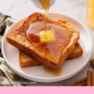 Pinterest graphic of a plate with two pieces of french toast with butter on top with maple syrup poured on top.