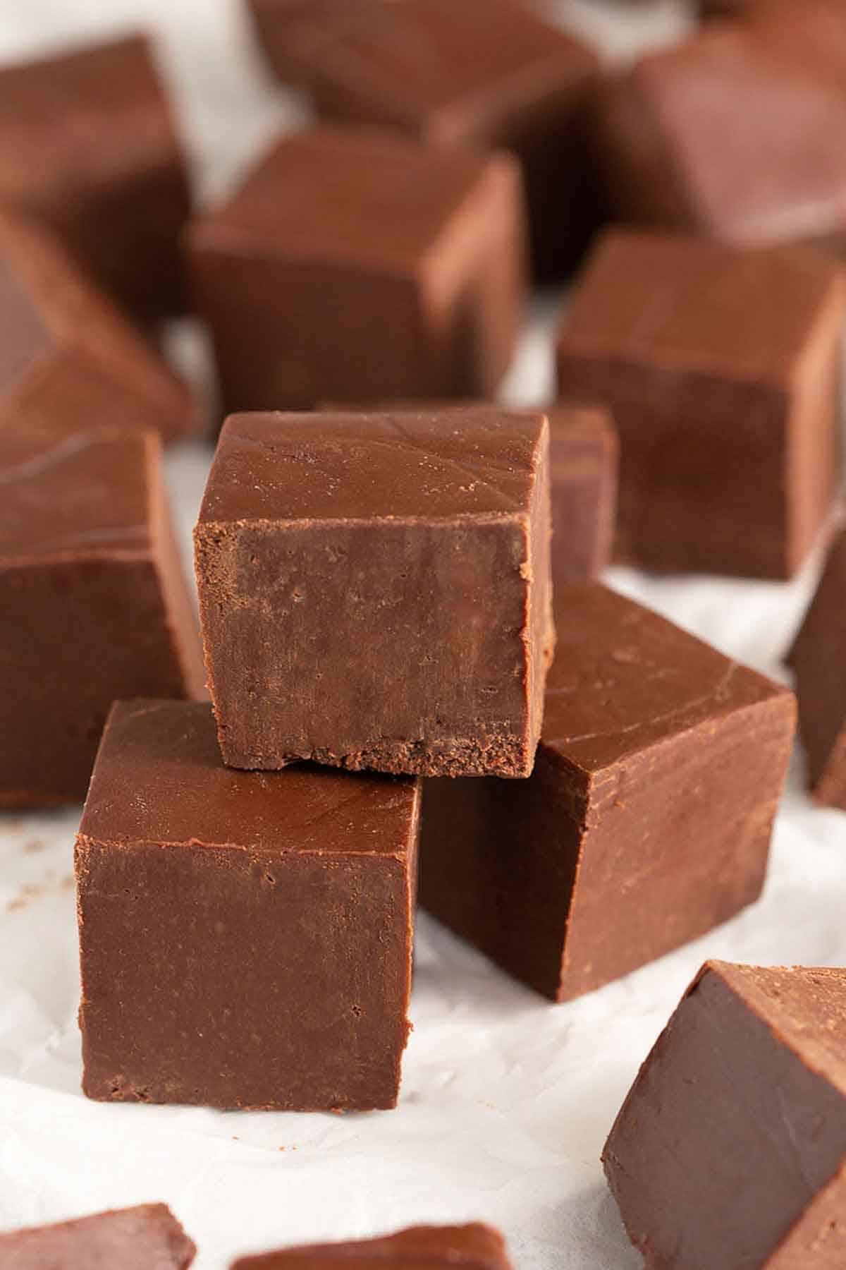 Multiple pieces of fudge with one piece stacked on top.