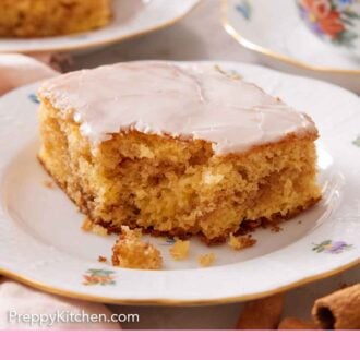 Pinterest graphic of honey bun cake with a bite taken out of it.