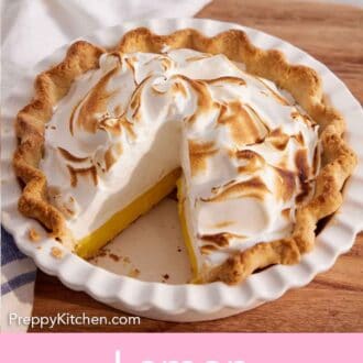 Pinterest graphic of a baking dish with a lemon meringue pie inside with one slice cut out.