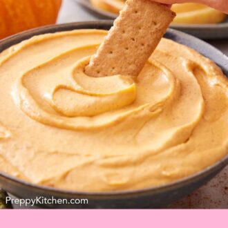 Pinterest graphic of a cracker dipped into a pumpkin dip in a bowl.