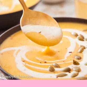 Pinterest graphic of a spoonful of pumpkin soup lifted up from a bowl.