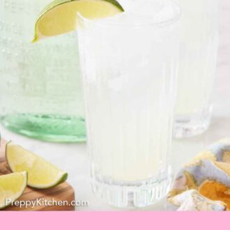 Pinterest graphic of two glasses of ranch water with lime wedges on the rim and a bottle of tequila in the back.