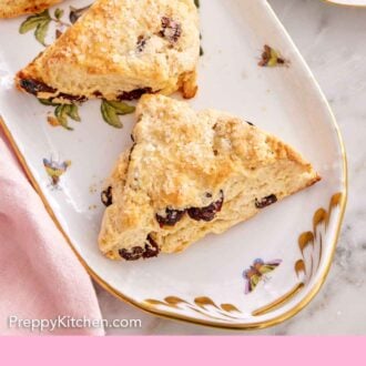 Pinterest graphic of a platter with three scones with dried cranberries.