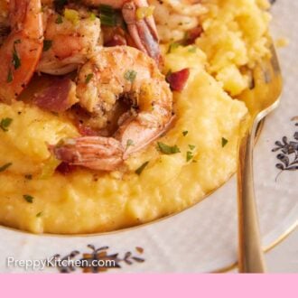 Pinterest graphic of a fork inside of a plate of shrimp and grits.