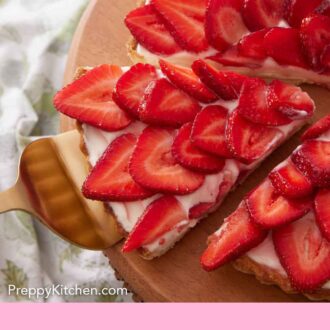 Pinterest graphic of a cut slice being pulled out of strawberry tart on a cake stand.